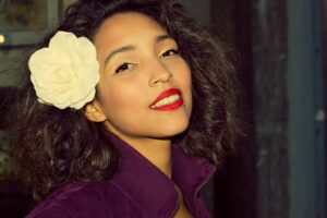 a woman with a flower in her hair