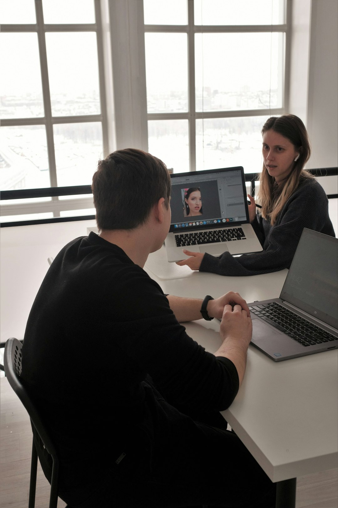 Photo by Aleksandra Sapozhnikova man in black long sleeve shirt using macbook pro